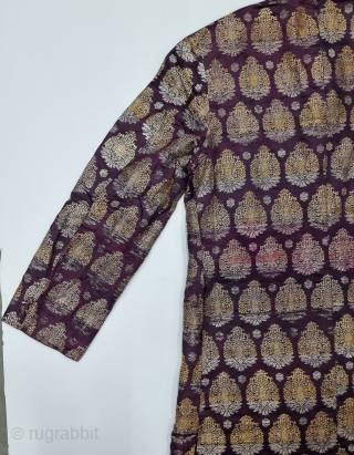 An very Unique Achkan (Coat) Real Zari Brocade (Real Zari)  With Fine Floral Butas in Weaving on Gold and Silver Thread  Lined with Cotton From the Varanasi Uttar Pradesh, India.
C.1900-1925. 
Its size is  ...