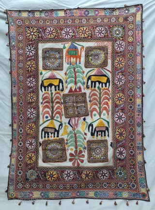 One of the best and rarest example of Dharaniya  Applique Wall Hanging . 
Appliqued with silk and cotton on cotton base with embroidery and decorated with pom-poms with  mirror work,
Made and used by  ...