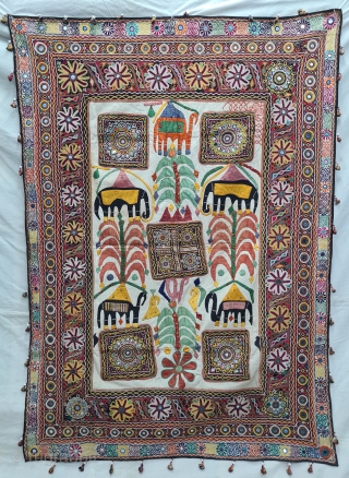 One of the best and rarest example of Dharaniya  Applique Wall Hanging . 
Appliqued with silk and cotton on cotton base with embroidery and decorated with pom-poms with  mirror work,
Made and used by  ...