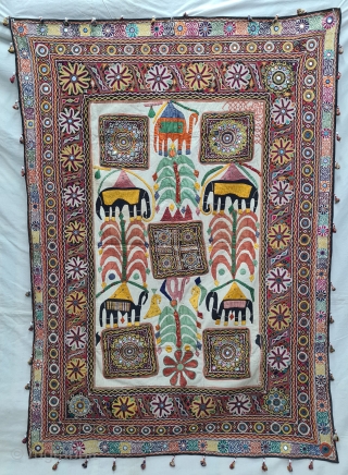 One of the best and rarest example of Dharaniya  Applique Wall Hanging . 
Appliqued with silk and cotton on cotton base with embroidery and decorated with pom-poms with  mirror work,
Made and used by  ...