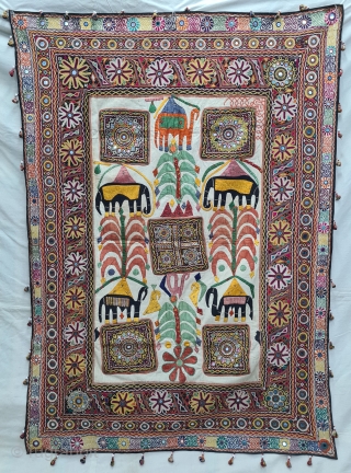 One of the best and rarest example of Dharaniya  Applique Wall Hanging . 
Appliqued with silk and cotton on cotton base with embroidery and decorated with pom-poms with  mirror work,
Made and used by  ...