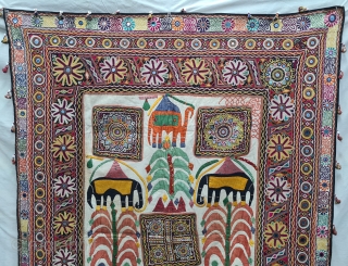 One of the best and rarest example of Dharaniya  Applique Wall Hanging . 
Appliqued with silk and cotton on cotton base with embroidery and decorated with pom-poms with  mirror work,
Made and used by  ...