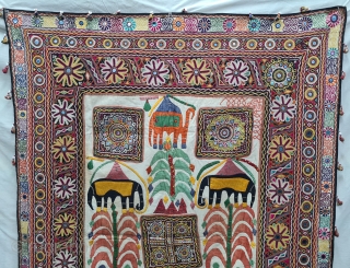 One of the best and rarest example of Dharaniya  Applique Wall Hanging . 
Appliqued with silk and cotton on cotton base with embroidery and decorated with pom-poms with  mirror work,
Made and used by  ...