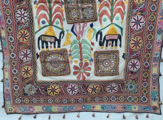 One of the best and rarest example of Dharaniya  Applique Wall Hanging . 
Appliqued with silk and cotton on cotton base with embroidery and decorated with pom-poms with  mirror work,
Made and used by  ...