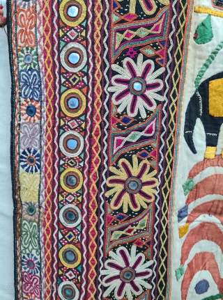 One of the best and rarest example of Dharaniya  Applique Wall Hanging . 
Appliqued with silk and cotton on cotton base with embroidery and decorated with pom-poms with  mirror work,
Made and used by  ...