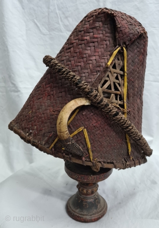 Hat, Naga People, Kalyo-Kengyu ethnics group, Northeastern India.
Cane, A red-dyed woven cane conical-shaped warrior's interwoven in typical fashion. There may have been a boar's tusk attached to the front.
Early to mid-20th century.
Its  ...