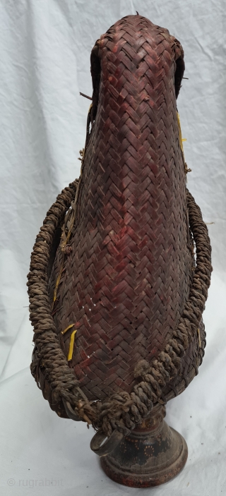 Hat, Naga People, Kalyo-Kengyu ethnics group, Northeastern India.
Cane, A red-dyed woven cane conical-shaped warrior's interwoven in typical fashion. There may have been a boar's tusk attached to the front.
Early to mid-20th century.
Its  ...