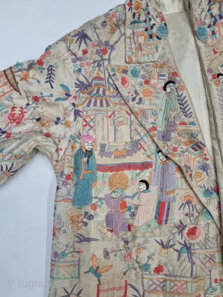 An Unique Chinese Art Embroidered Coat with lavish pastel hand embroidered Chinese Monk, Ladies, Monastery with  Gardens , Trees and birds amidst deep foliate patterns throughout. 2 button coat style with  ...