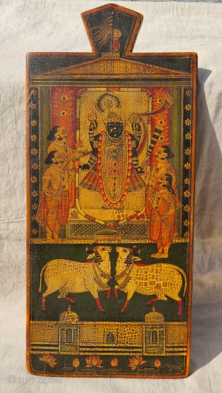 Worship of Dwarkadhishji, Kankroli. Painting on wooden panel. Late 19th -early 20th century. Nathdwara. Rajasthan, India.
This was most likely the lid of a wooden box which contained the deity’s jewellery or items  ...