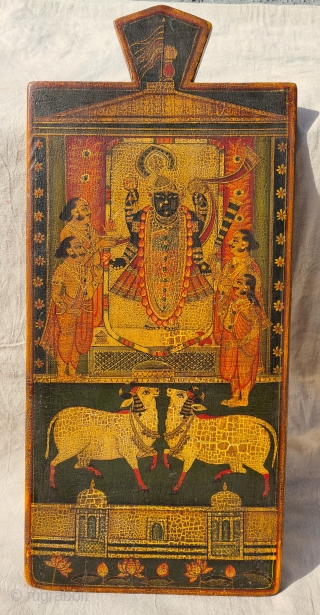 Worship of Dwarkadhishji, Kankroli. Painting on wooden panel. Late 19th -early 20th century. Nathdwara. Rajasthan, India.
This was most likely the lid of a wooden box which contained the deity’s jewellery or items  ...