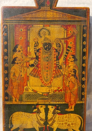 Worship of Dwarkadhishji, Kankroli. Painting on wooden panel. Late 19th -early 20th century. Nathdwara. Rajasthan, India.
This was most likely the lid of a wooden box which contained the deity’s jewellery or items  ...