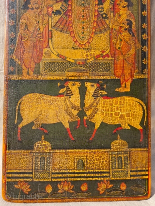 Worship of Dwarkadhishji, Kankroli. Painting on wooden panel. Late 19th -early 20th century. Nathdwara. Rajasthan, India.
This was most likely the lid of a wooden box which contained the deity’s jewellery or items  ...