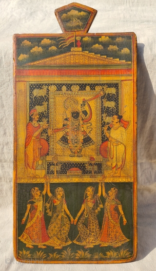 Worship of Shrinathji with Gopashthami pichhavai. Painting on wooden panel. Late 19th -early 20th century. Nathdwara. Rajasthan, India.
This was most likely the lid of a wooden box which contained the deity’s jewellery  ...