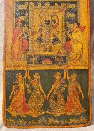 Worship of Shrinathji with Gopashthami pichhavai. Painting on wooden panel. Late 19th -early 20th century. Nathdwara. Rajasthan, India.
This was most likely the lid of a wooden box which contained the deity’s jewellery  ...