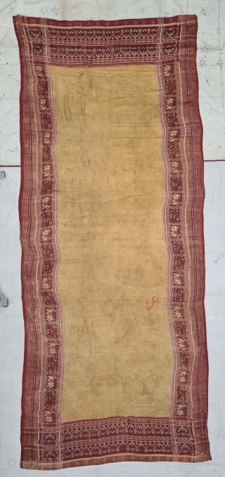 Patola Sari,Silk Double Ikat.Probably Patan Gujarat. India.
This Patola Uses one of the most Rare designs known as Panetar Yellow Patola, 
It belongs to Nagar Brahmin Group of Gujarat India.

C.1825-1850.

Its size is 12cmX290cm(20210804_161933).
 