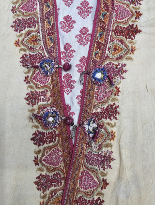 An Kashmir Multi-Color Embroidery Choga (Coat) Borders with Keri butis, From Kashmir, India. India.

There are imitation pockets in the front and similar motifs on the sleeves, The back and Shoulders are Decorated  ...