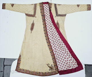 An Kashmir Multi-Color Embroidery Choga (Coat) Borders with Keri butis, From Kashmir, India. India.

There are imitation pockets in the front and similar motifs on the sleeves, The back and Shoulders are Decorated  ...