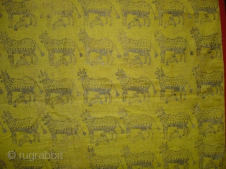 Pichwai for the Gopashtami From Gujarat India.Silver-tinsel Stamped with gum on yellow muslin cotton.Circa 1900.Its size is 82cmX100cm(DSC01463).               