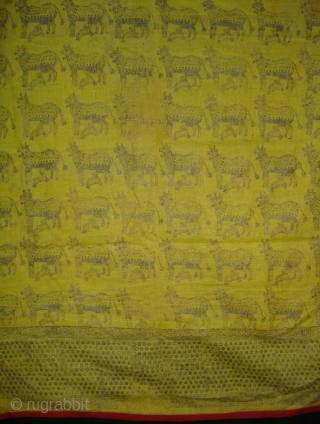 Pichwai for the Gopashtami From Gujarat India.Silver-tinsel Stamped with gum on yellow muslin cotton.Circa 1900.Its size is 82cmX100cm(DSC01463).               