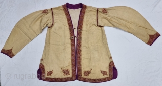 A Kashmir Embroidery Jacket-Waist Coat, Borders with Keri butis, From Kashmir, India. India. 

The front and similar motifs on the sleeves, The back and Shoulders are Decorated with Elaborate Keri Butas..

C.1875 -1900.  ...