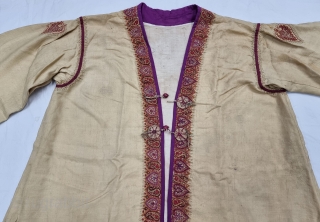 A Kashmir Embroidery Jacket-Waist Coat, Borders with Keri butis, From Kashmir, India. India. 

The front and similar motifs on the sleeves, The back and Shoulders are Decorated with Elaborate Keri Butas..

C.1875 -1900.  ...