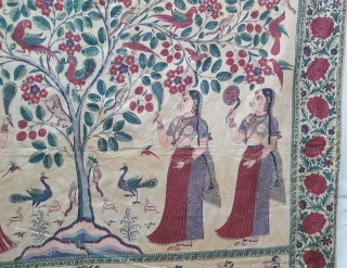 A Roller Print Pichwai depicting the Lord in the form of a tree with abundance and life.  It's flanked by Gopis on both sides venerating the  divine and the lower  ...