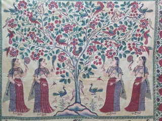 A Roller Print Pichwai depicting the Lord in the form of a tree with abundance and life.  It's flanked by Gopis on both sides venerating the  divine and the lower  ...