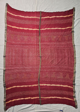  Ceremonial Badla Work (RealSilver) Tie and Dye Odhani known as Kumbhi,

Tie and Dye Work on the Gajji-Silk From Kutch Region of Gujarat, India.

c.1875-1900.

Its size is 120cmX165cm.

This were Traditionally used mainly by  ...
