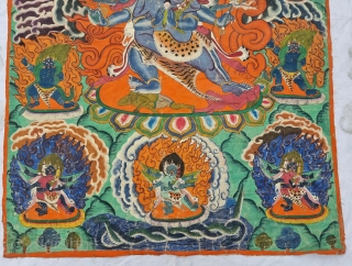 Thangka Shadbuja Mahakala From Tibet .
Distemper on cloth; recto with Tibetan inscriptions in gold identifying the various figures.

Shadbuja Mahakala is the principal protector deity of the Gelug school, indicated by the monks  ...