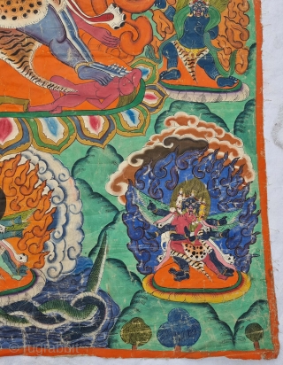 Thangka Shadbuja Mahakala From Tibet .
Distemper on cloth; recto with Tibetan inscriptions in gold identifying the various figures.

Shadbuja Mahakala is the principal protector deity of the Gelug school, indicated by the monks  ...