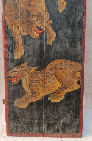 Dramatically Painted doors depicting symbols of Tibetan mythology such as Tigers Dragons and Lamas From Tibet. C.1875-1900. Its size. is 72cmX161cm (20221031_144434 ).          