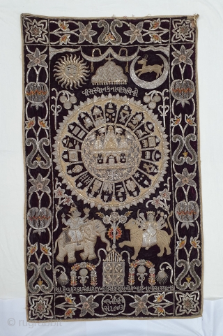 Jain Temple Hanging, Patan Gujarat, India. C.1900. Silver and gold gilt embroidery Cotton-Velvet. Its size is 77cmX123cm.   
This a holy piece, showing the Sun and Moon with twenty different marks  ...