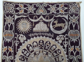 Jain Temple Hanging, Patan Gujarat, India. C.1900. Silver and gold gilt embroidery Cotton-Velvet. Its size is 77cmX123cm.   
This a holy piece, showing the Sun and Moon with twenty different marks  ...