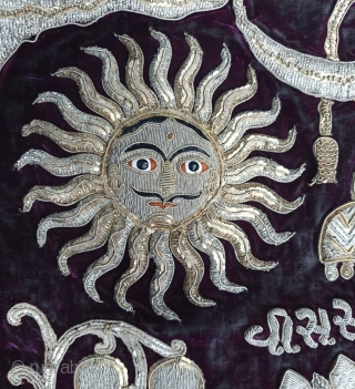 Jain Temple Hanging, Patan Gujarat, India. C.1900. Silver and gold gilt embroidery Cotton-Velvet. Its size is 77cmX123cm.   
This a holy piece, showing the Sun and Moon with twenty different marks  ...