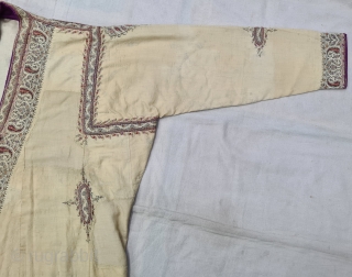 An Rare Kashmir Bunara Kani Work Choga (Coat) Borders with Keri butis, From Kashmir, India. India. There are imitation pockets in the front and similar motifs on the sleeves, The back and  ...