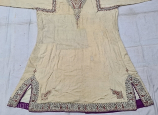 An Rare Kashmir Bunara Kani Work Choga (Coat) Borders with Keri butis, From Kashmir, India. India. There are imitation pockets in the front and similar motifs on the sleeves, The back and  ...