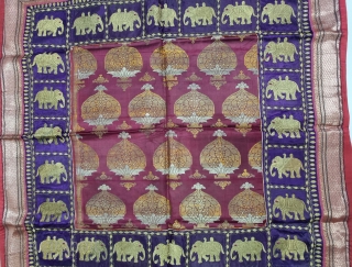 Unusual Temple Hanging Zari Brocade (Real Zari) with Fine Kalabattu Embroidery Elephant Design Border (Real Zari Thread) From Jamnagar Gujarat India. India.

C.1875-1900.

Its size is 98cmX98cm(20221122_141511).        