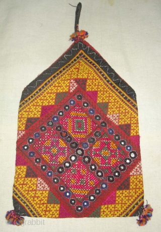 Dowry Bag(Bhujki),Mahar group,From Jaisalmer District of Rajasthan.India.Cotton embroidered with silk and cotton,mirrors,cotton tassels and string.H.30cm,W.20cm(DSC05959 New).                 