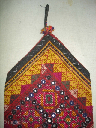 Dowry Bag(Bhujki),Mahar group,From Jaisalmer District of Rajasthan.India.Cotton embroidered with silk and cotton,mirrors,cotton tassels and string.H.30cm,W.20cm(DSC05959 New).                 