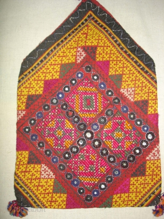 Dowry Bag(Bhujki),Mahar group,From Jaisalmer District of Rajasthan.India.Cotton embroidered with silk and cotton,mirrors,cotton tassels and string.H.30cm,W.20cm(DSC05959 New).                 