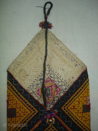 Dowry Bag(Bhujki),Mahar group,From Jaisalmer District of Rajasthan.India.Cotton embroidered with silk and cotton,mirrors,cotton tassels and string.H.30cm,W.20cm(DSC05959 New).                 