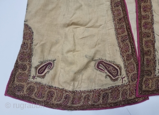 An Kashmir Embroidery Choga (Coat) Borders with Keri butis, From Kashmir, India. India. 

There are imitation pockets in the front and similar motifs on the sleeves, The back and Shoulders are Decorated  ...