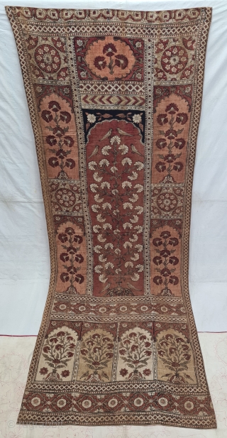 KalamkariTree of life from Lahore West (Pakistan) Punjab India. India. Kalamkari on the cotton with exotic birds and trees all within mihrab. Surrounded by a lozenge border .

Late 19th Early 20th Century.

  ...