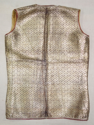 Boys Waistcoat(sadri or Jacket), Zari Brocade (Gold Plated Real Silver Threads) On Gajji-Silk,
Worn by Royal Vohra Muslims Community Of Sidhpur,Patan, Gujarat. India.

C.1875. 

L-54cm,W-38cm(DSC09622).          