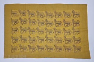 Pichwai Fragment for the Gopashtami From Gujarat India. Silver-tinsel Stamped with gum on Yellow Muslin cotton.

Circa 1875-1900.

Its size is 50cmX80cm  (20231226_142039).           