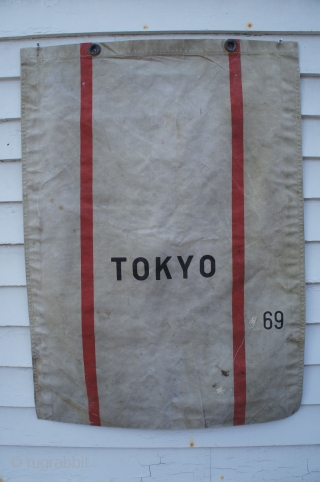 Post WW2 painted canvas mail bag for delivery of mail to Japan, apparently for Tokyo in particular. 28" x 39". A few random rust spots but no holes or wear. Brass gromets  ...