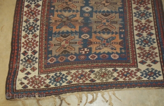 Antique Kazak Caucasian rug in good low pile condition. Still has some of its original tassel endings. 4'6" x 7'6."             