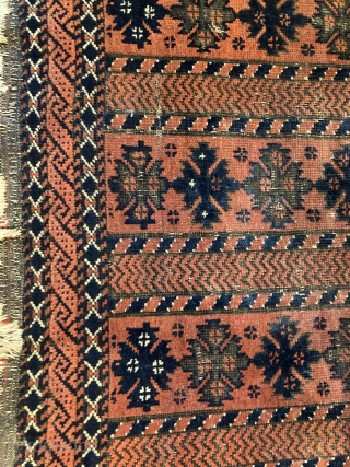 Antique tribal Baluch rug 3' x 4'6" with interesting and unusual pattern. Rug still has one of its original kilim endings. Rug has thin pile and some obvious signs of wear, but  ...