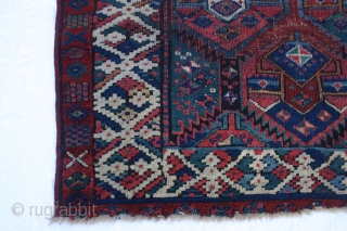 Early Sauj Bolag, 210x159 cm. rug, corrosion, some holes and wear but with some outstanding colours on very glossy wool.
Lovely main border with long and shiny pile.
Strange humanoids in the secondary border.
Some  ...