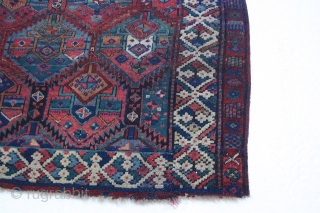 Early Sauj Bolag, 210x159 cm. rug, corrosion, some holes and wear but with some outstanding colours on very glossy wool.
Lovely main border with long and shiny pile.
Strange humanoids in the secondary border.
Some  ...